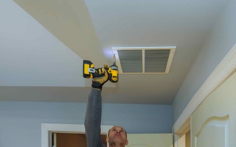 worker builder installing air conditioner ventilat H9X49HH